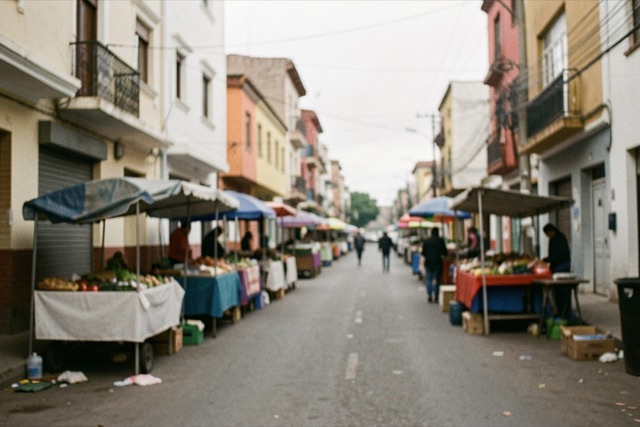 A quiet urban street with closed market stalls